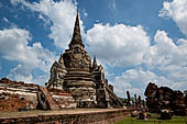 Ayutthaya, Thailand. Wat Phra Si Sanphet, the east chedi on the right ruins of the surrounding gallery. 